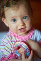 baby playing with toys at home photo