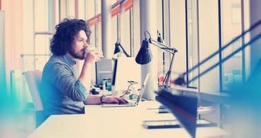 businessman working using a laptop in startup office photo