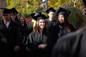Group of diverse international graduating students celebrating photo