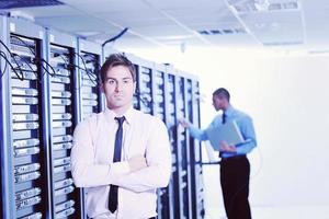 it engineers in network server room photo