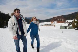 happy young couple having fun on fresh show on winter vacation photo