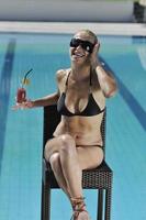 woman relax on swimming pool photo