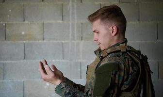 muslim soldier praying photo