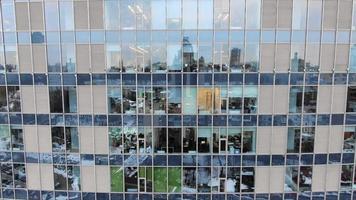 Exterior of modern skyscraper with reflective glass windows video