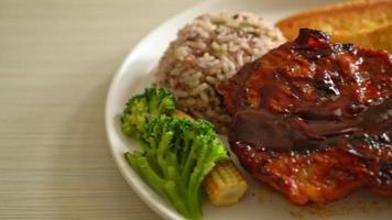 barbecue pork steak with rice berry on white plate video