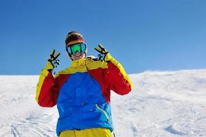 skiing on fresh snow at winter season at beautiful sunny day photo