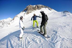 winter portrait of friends at skiing photo