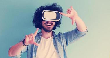 man using VR headset glasses of virtual reality photo