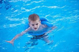 child on swimming poo photo