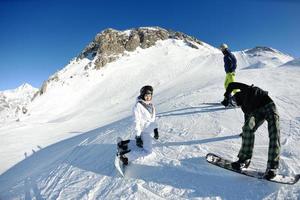 winter portrait of friends at skiing photo