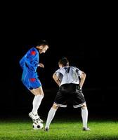 football players in action for the ball photo