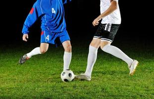 football players in action for the ball photo