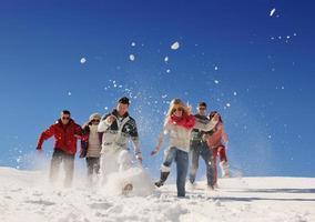 friends have fun at winter on fresh snow photo