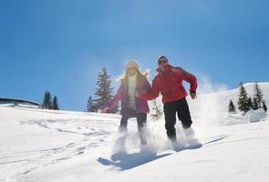 young couple on winter vacation photo