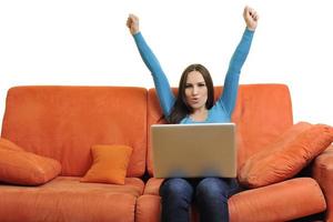 woman using a laptop computer at home photo