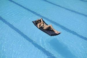 beautiful woman relax on swimming pool photo