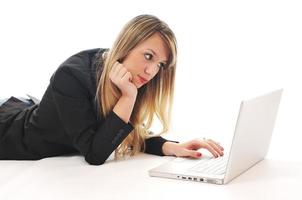 one young girl work on laptop isolated on white photo