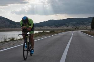 triathlon athlete riding bike photo