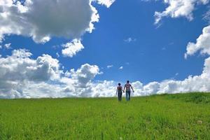 Portrait of romantic young couple smiling together outdoor photo