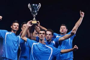 soccer players celebrating victory photo