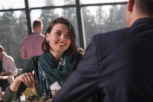 Closeup shot of young woman and man having meal. photo