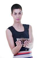 young lady isoladet on white background hold tasty chocolate photo