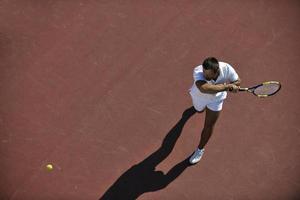 young man play tennis photo