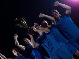 soccer players celebrating victory photo