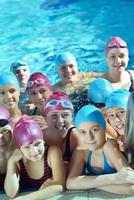 happy children group  at swimming pool photo