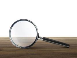 magnifying glass or magnifying glass on a wooden table photo