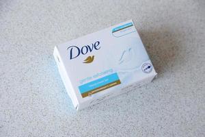 Ternopil, Ukraine - May 8, 2022 Production with Dove Logo on textured surface photo