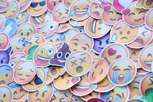 Ternopil, Ukraine - May 8, 2022 Large set of stickers with Emoji yellow faces. Emoji is a pictogram or smiley embedded in text and used in electronic messages and web page photo