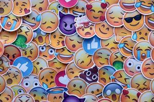 Ternopil, Ukraine - May 8, 2022 Large set of stickers with Emoji yellow faces. Emoji is a pictogram or smiley embedded in text and used in electronic messages and web page photo