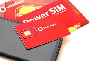 Ternopil, Ukraine - April 24, 2022 Vodafone Power SIM mobile card by Vodafone group plc - British multinational telecommunications company who operates networks in 22 countries photo