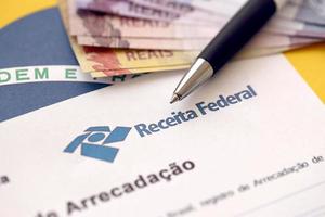 Ternopil, Ukraine - May 8, 2022 Comprovante de arrecadacao - proof of collection report with Brazilian Receita Federal logo. Receita Federal is Brazilian federal revenue service agency photo