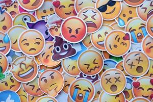 Ternopil, Ukraine - May 8, 2022 Large set of stickers with Emoji yellow faces. Emoji is a pictogram or smiley embedded in text and used in electronic messages and web page photo