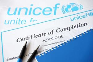 Ternopil, Ukraine - May 8, 2022 Volunteer certificate of completion from UNICEF - United Nations programm that provides humanitarian and developmental assistance to children photo