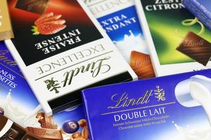 Ternopil, Ukraine - April 24, 2022 Lindt Chocolate on white background. Lindt and Spruengli AG is a Swiss chocolatier and confectionery company known for their chocolate bars photo