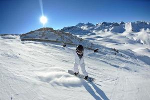 skiing on fresh snow at winter season at beautiful sunny day photo