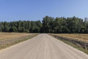 Rural road for cars and transport photo