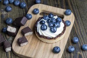 Tartlet with cream and blueberry flavor photo