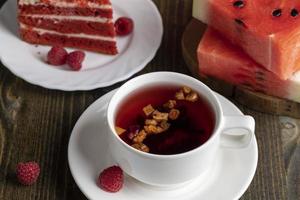 Red cake with cream and raspberry flavor photo