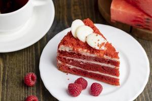 Red cake with cream and raspberry flavor photo