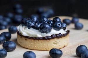 Tartlet with cream and blueberry flavor photo