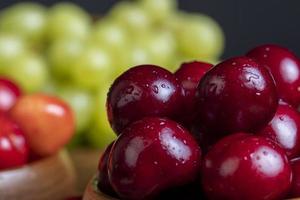 Sweet fresh cherries with other products photo