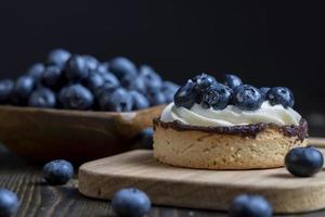 Tartlet with cream and blueberry flavor photo