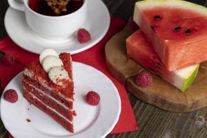 Red cake with cream and raspberry flavor photo