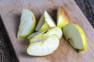 Sliced ripe apple on a cutting board photo