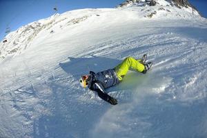 skiing on fresh snow at winter season at beautiful sunny day photo