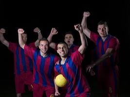 soccer players celebrating victory photo